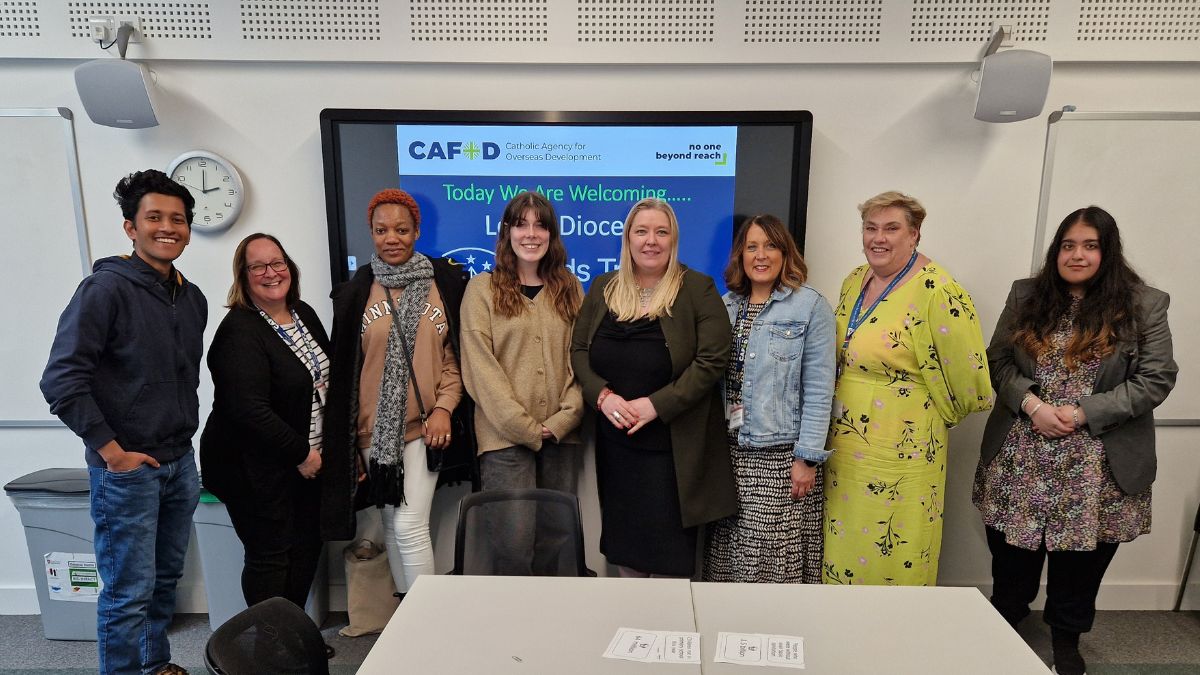 The Director of Catholic Mission in a group photo with seven other people