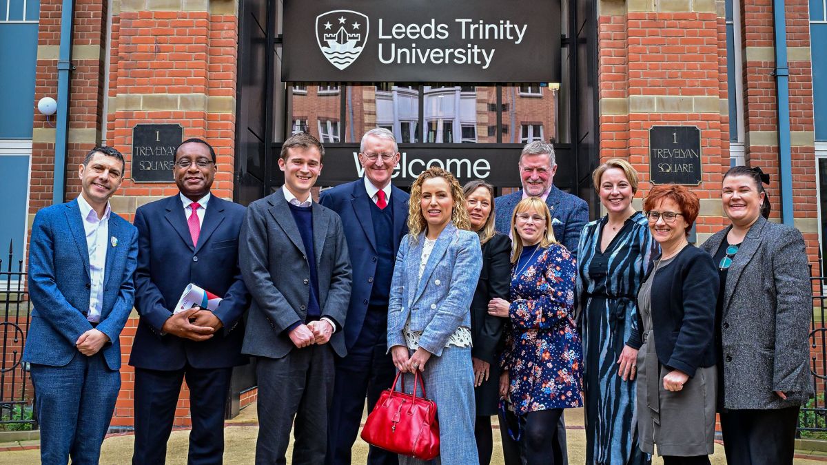A group picture in front of the City Campus